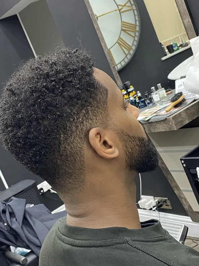 A curly top fade at Royal S.M