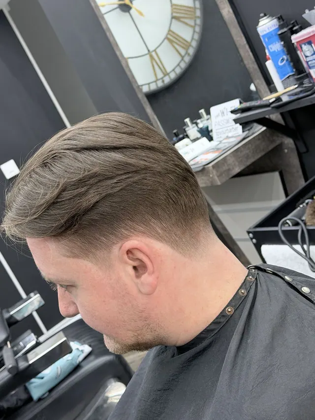 A side part and taper at Royal S.M